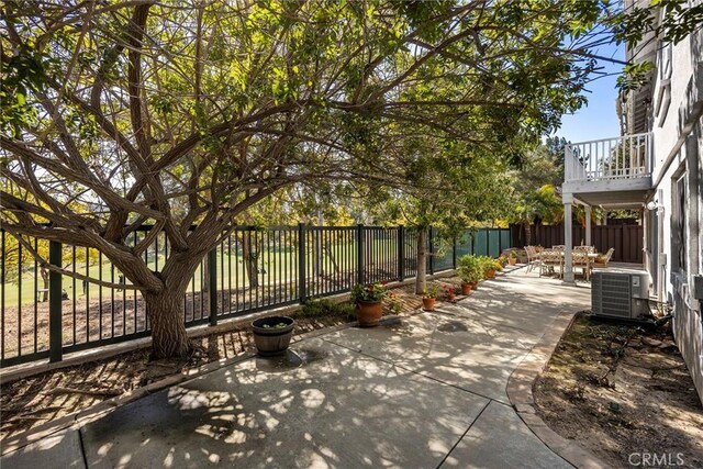 view of patio featuring central AC unit and a fenced backyard