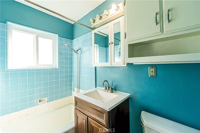 bathroom with shower / bathing tub combination, vanity, and toilet