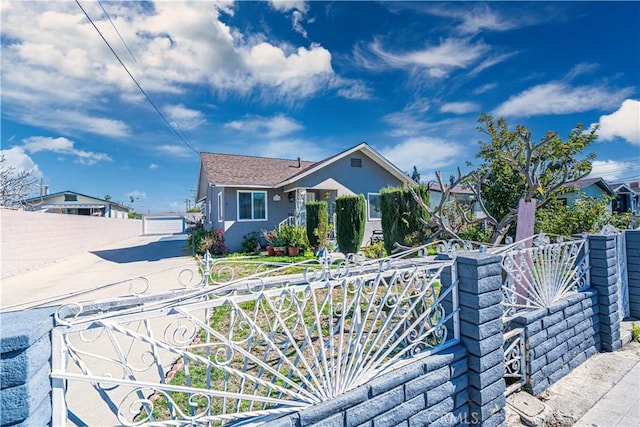 view of front of property with fence and stucco siding