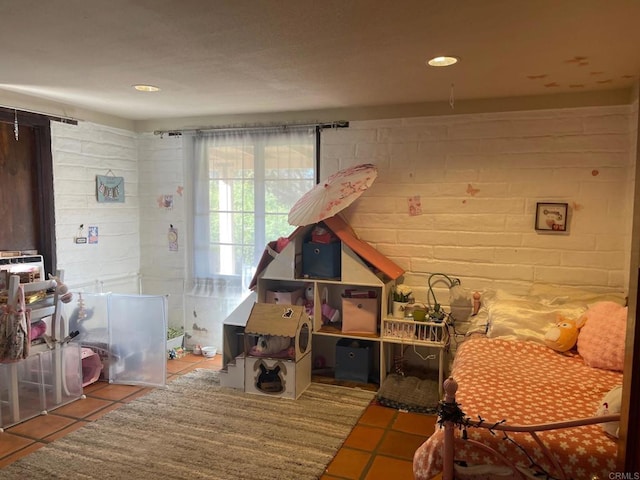 recreation room with tile patterned floors and recessed lighting