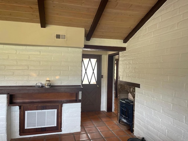 interior space featuring visible vents, vaulted ceiling with beams, wooden ceiling, and a wood stove