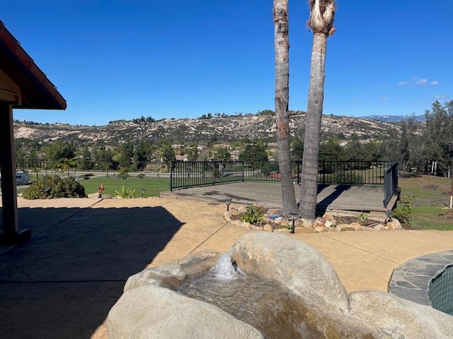 exterior space with a patio area and a mountain view