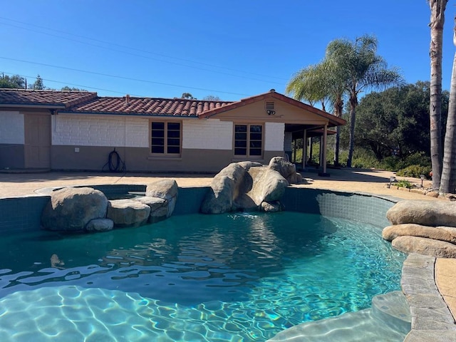 pool featuring a patio area