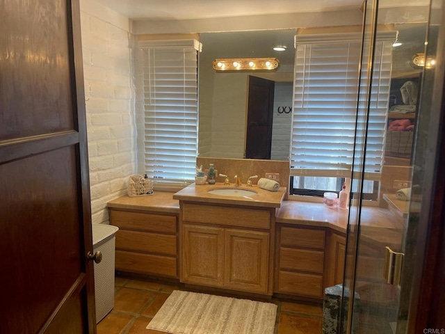 full bath with tile patterned floors and vanity