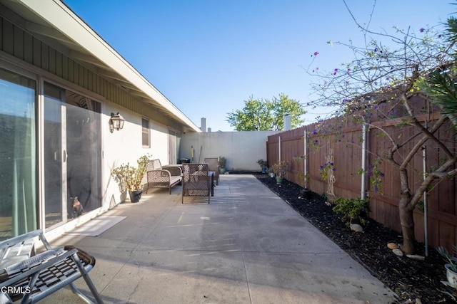 view of patio with a fenced backyard and an outdoor living space