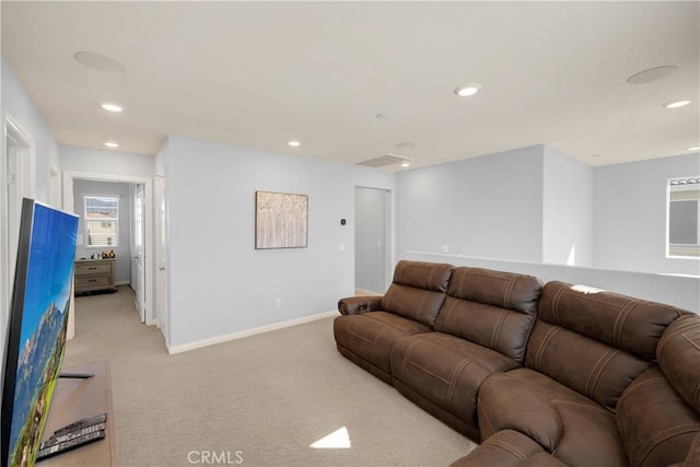 living room with baseboards, recessed lighting, and light colored carpet