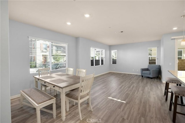 dining area featuring recessed lighting, visible vents, baseboards, and wood finished floors