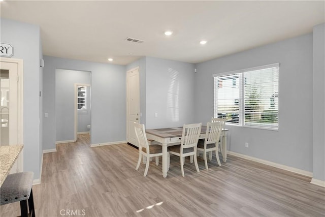 dining space with visible vents, recessed lighting, light wood-style flooring, and baseboards