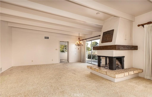 unfurnished living room with visible vents, carpet, a multi sided fireplace, and beam ceiling