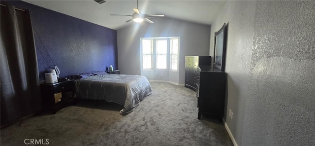 carpeted bedroom featuring lofted ceiling, ceiling fan, baseboards, and a textured wall