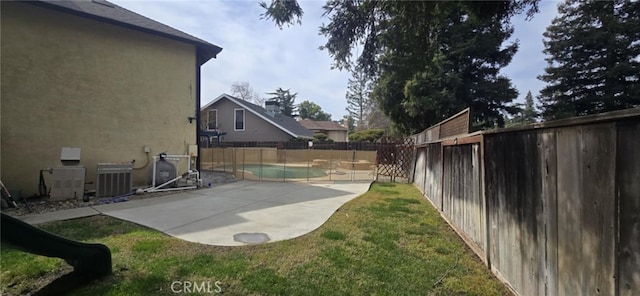 view of yard with central AC, a patio area, and a fenced backyard