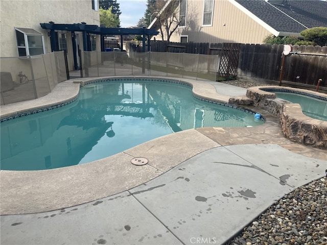 view of swimming pool with a fenced backyard, a fenced in pool, and a patio