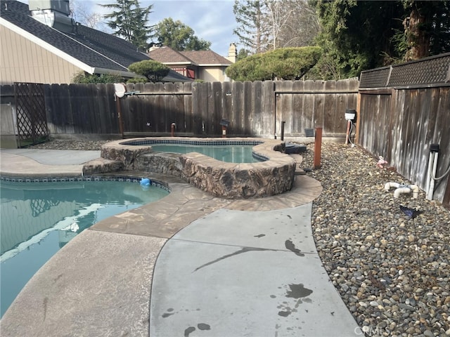 view of swimming pool with a fenced backyard and a fenced in pool