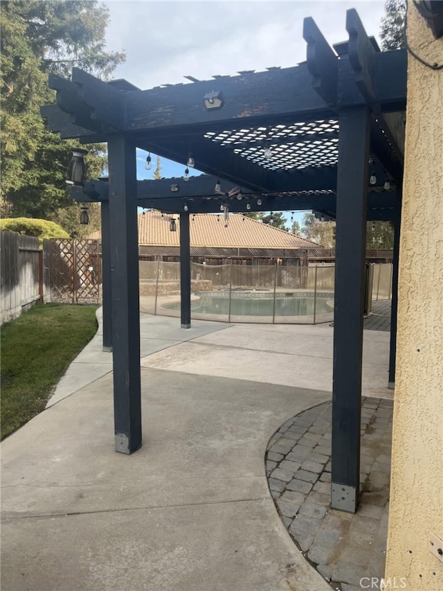 view of patio featuring fence