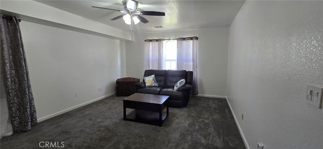 living area featuring carpet floors, visible vents, a textured wall, and baseboards