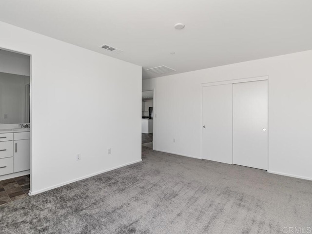 5106 Belle Way, Hemet, CA 92545 - unfurnished bedroom with carpet floors, visible vents, a sink, and baseboards