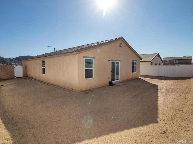 5106 Belle Way, Hemet, CA 92545 - rear view of house with fence and stucco siding