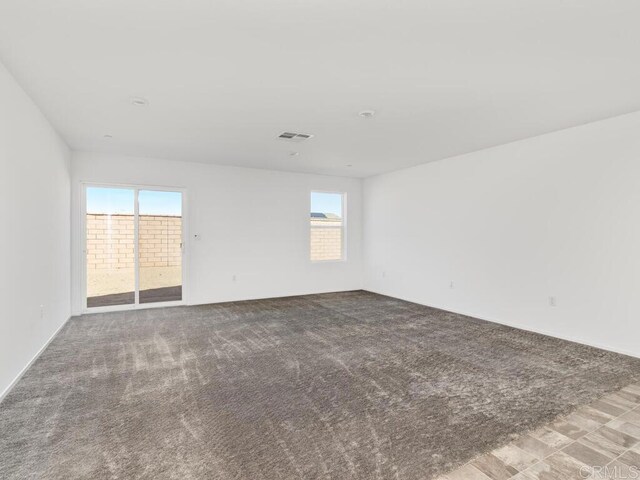 5106 Belle Way, Hemet, CA 92545 - carpeted empty room featuring visible vents