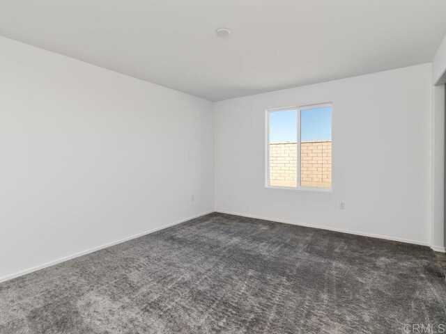5106 Belle Way, Hemet, CA 92545 - spare room with baseboards and dark colored carpet