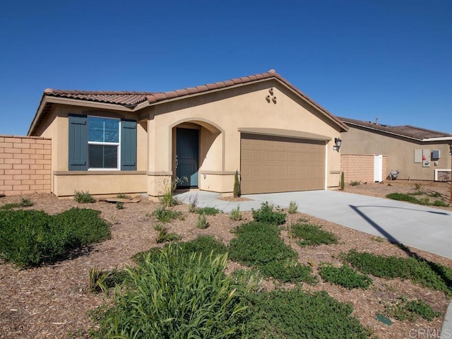 5106 Belle Way, Hemet, CA 92545 - mediterranean / spanish home with driveway, an attached garage, and stucco siding