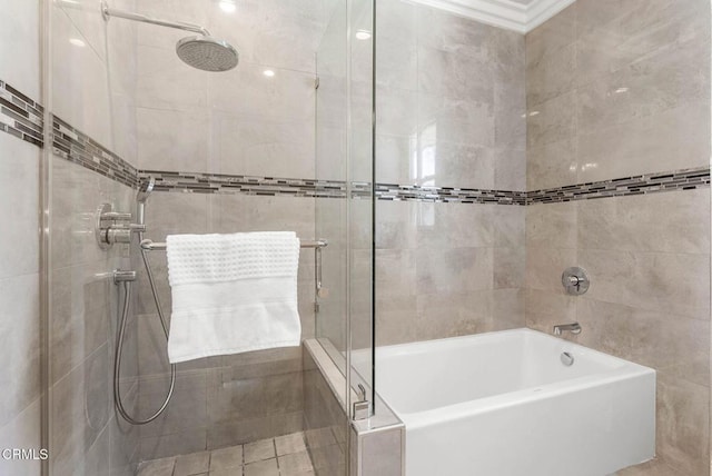 bathroom featuring a washtub and tiled shower