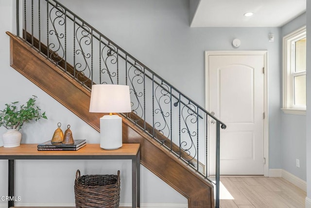 staircase featuring baseboards