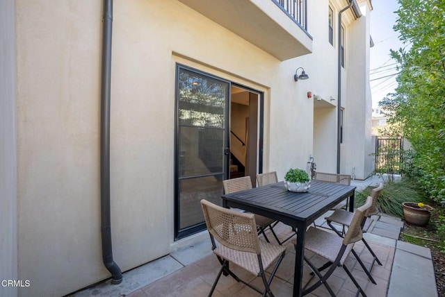 view of patio featuring outdoor dining area