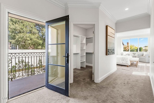 doorway to outside with carpet floors, baseboards, crown molding, and recessed lighting