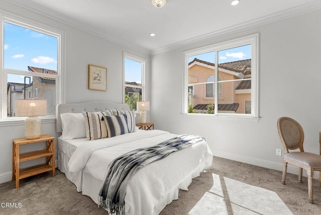 bedroom featuring carpet, multiple windows, baseboards, and crown molding