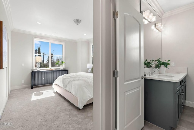 bedroom with crown molding, radiator, and a sink