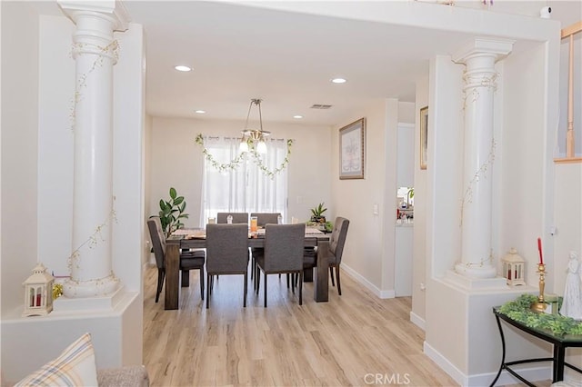 dining space featuring baseboards, light wood finished floors, decorative columns, and recessed lighting