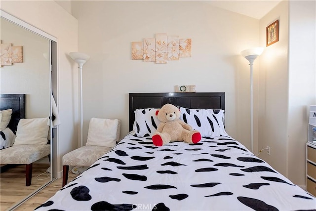 bedroom featuring wood finished floors