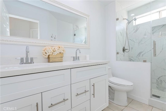 full bath featuring toilet, a sink, a marble finish shower, and double vanity