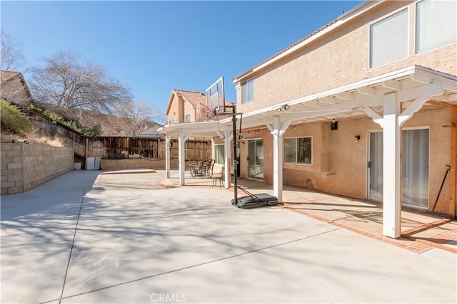 exterior space featuring a fenced backyard and a pergola