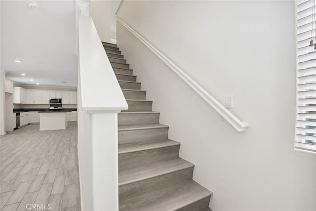 3235 E Yellowstone Dr, Ontario, CA 91762 - stairs featuring recessed lighting and wood finished floors