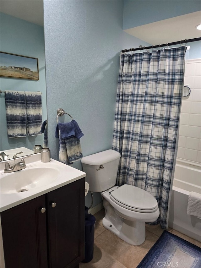 full bath featuring shower / tub combo with curtain, vanity, toilet, and tile patterned floors