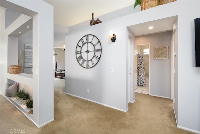 hallway with recessed lighting, carpet, and baseboards