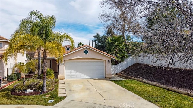 view of front of home featuring driveway, a tile roof, an attached garage, fence, and stucco siding