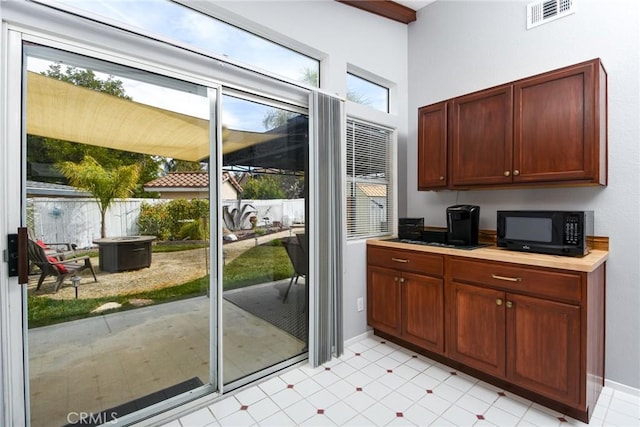 doorway featuring plenty of natural light and visible vents