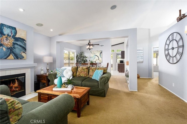 living room with a fireplace, lofted ceiling, recessed lighting, light carpet, and baseboards