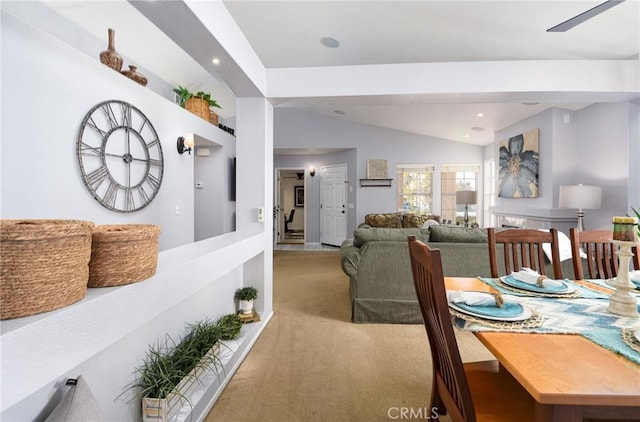 dining space with vaulted ceiling, carpet flooring, and recessed lighting