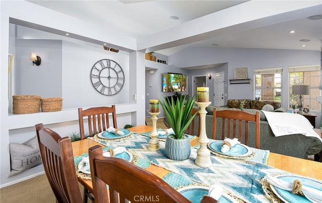 carpeted dining area featuring vaulted ceiling and recessed lighting