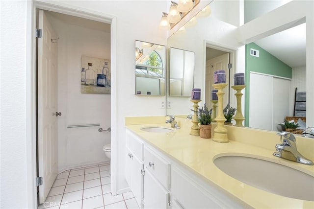 full bathroom with toilet, visible vents, a sink, and tile patterned floors