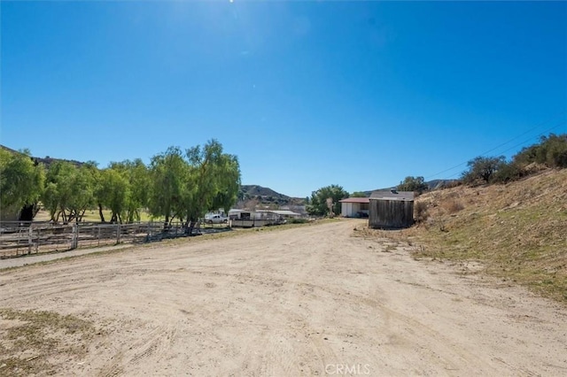 view of street featuring a mountain view and a rural view