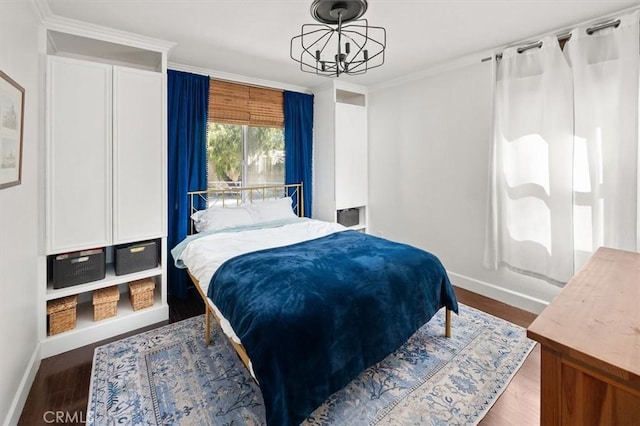 16070 Baker Canyon Rd, Canyon Country, CA 91390 - bedroom featuring an inviting chandelier, wood finished floors, baseboards, and ornamental molding