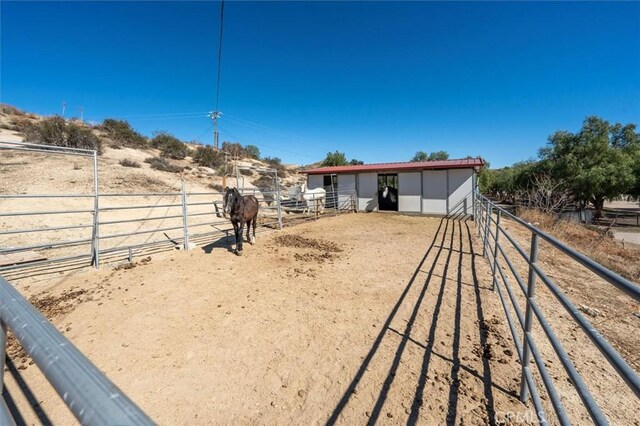 16070 Baker Canyon Rd, Canyon Country, CA 91390 - view of yard with an outdoor structure, a rural view, and an exterior structure