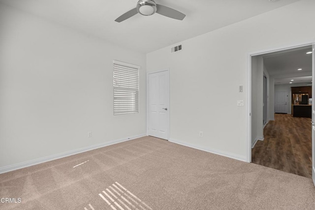 unfurnished room featuring carpet, recessed lighting, visible vents, ceiling fan, and baseboards