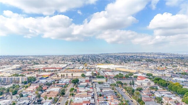 birds eye view of property featuring a city view