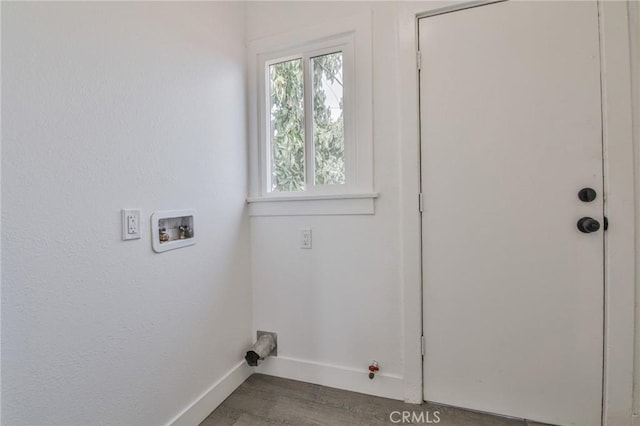 washroom with hookup for a washing machine, gas dryer hookup, wood finished floors, laundry area, and baseboards