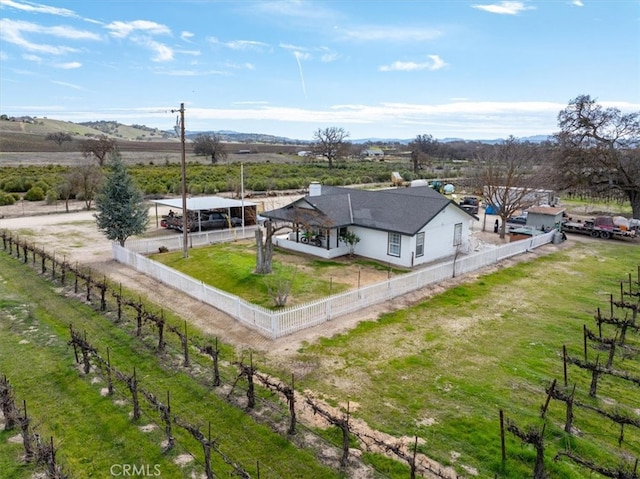 birds eye view of property with a rural view